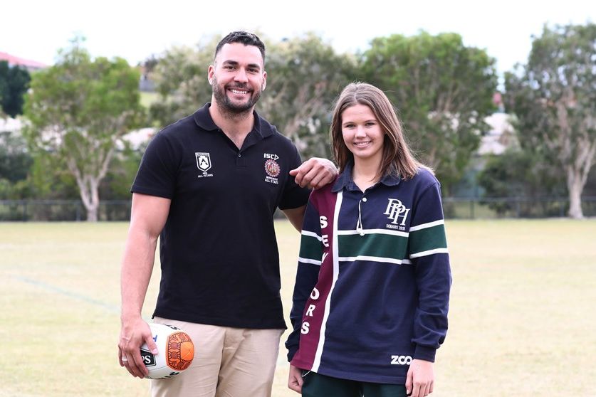 NRL Young Person of the Year, Holly Summers, with Titans captain Ryan James. ©NRL Photos